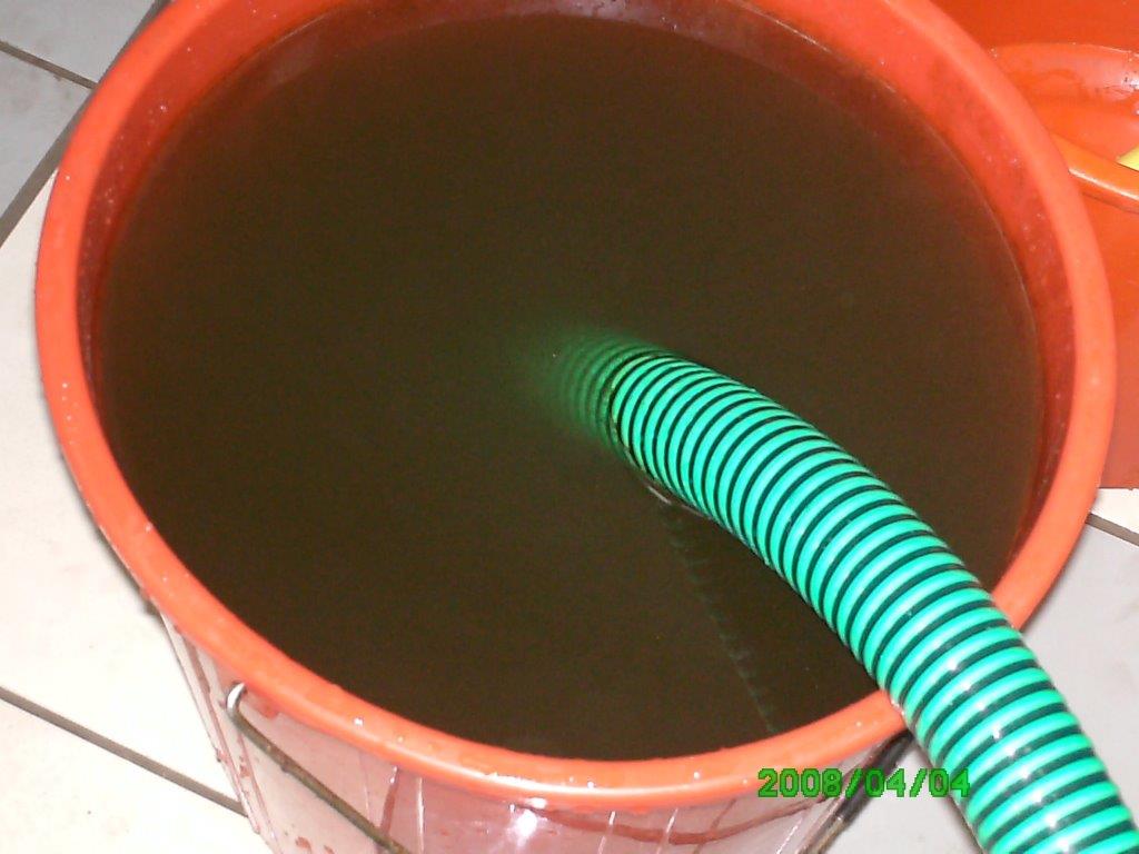 Before treatment — contaminated water sample in barrel